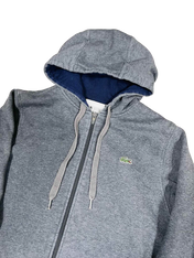 Szürke cipzáras kapucnis pulóver Lacoste logóval, streetwear stílus